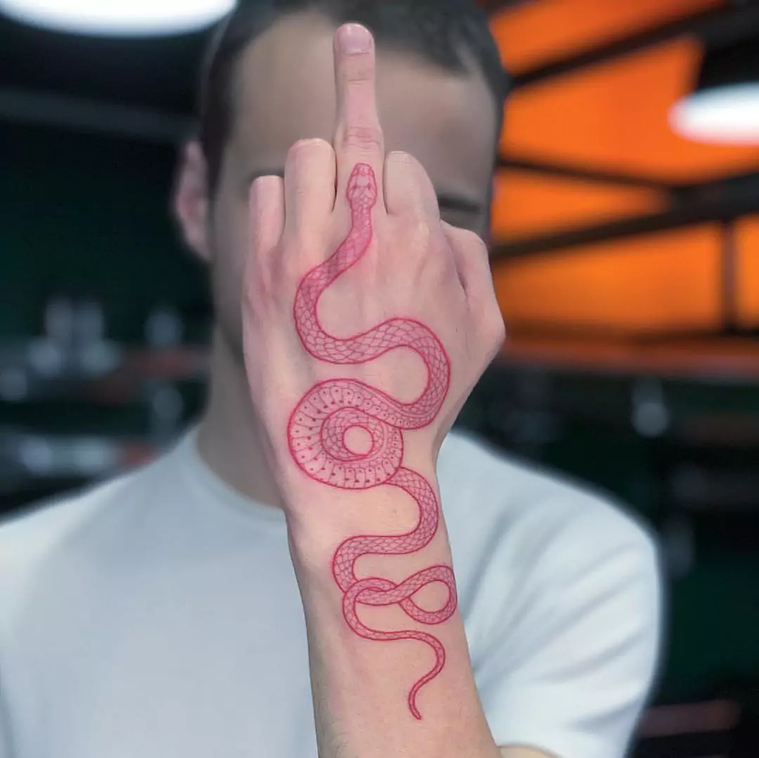 red snake finger tattoo