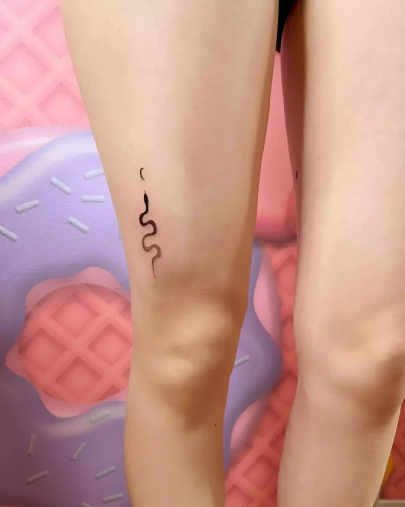 simple snake tattoo on the leg