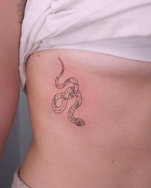 simple snake tattoo on the rib