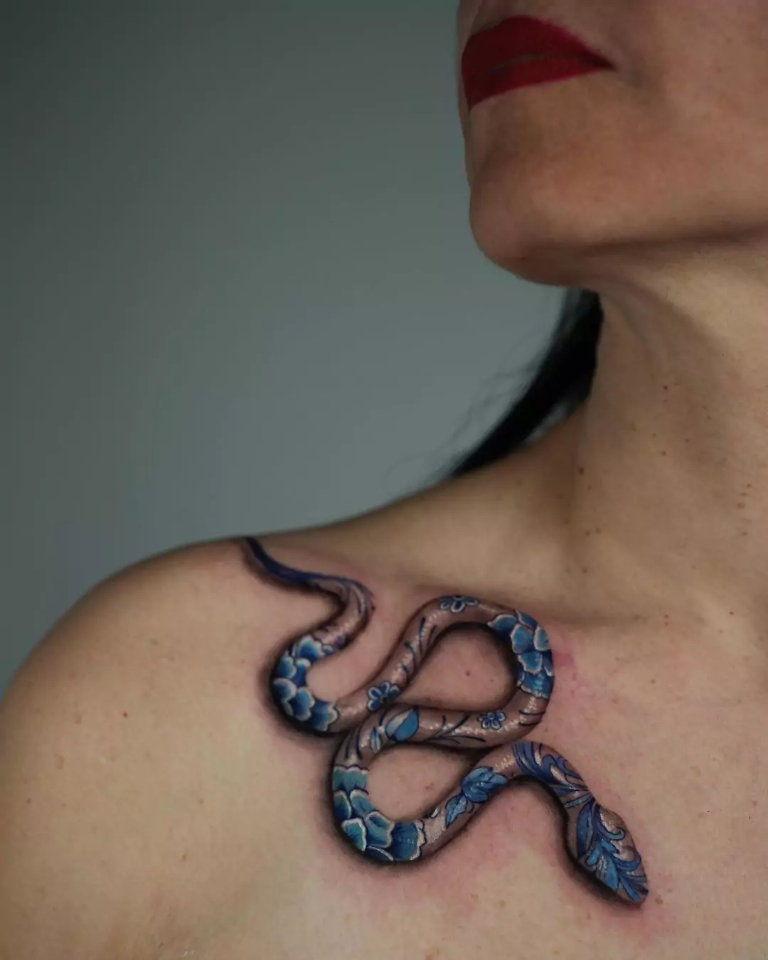 small realistic snake collarbone tattoo