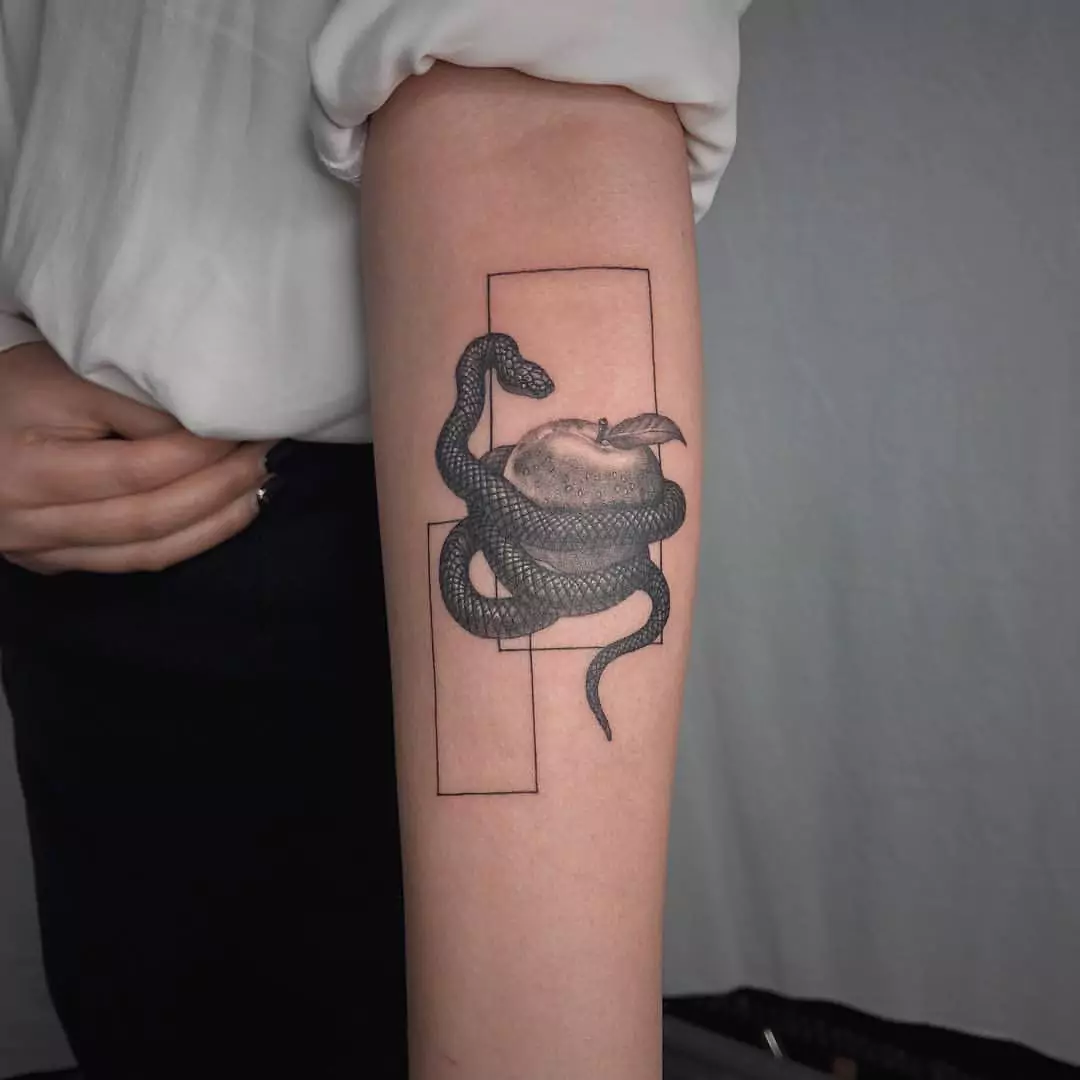 snake and apple tattoo in frame