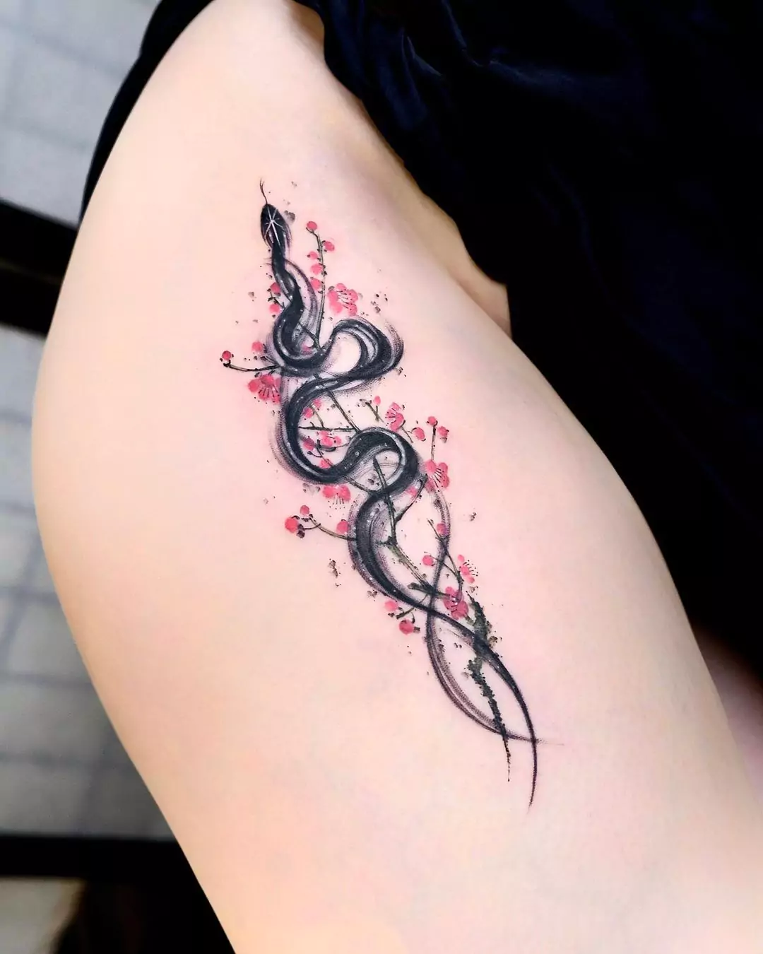 snake and cherry blossoms tattoo