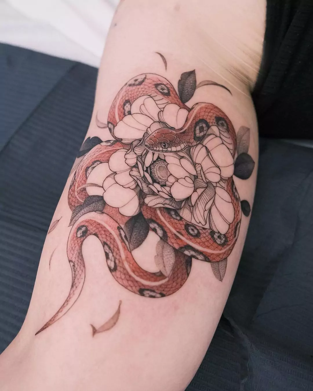 snake and flower hand tattoo