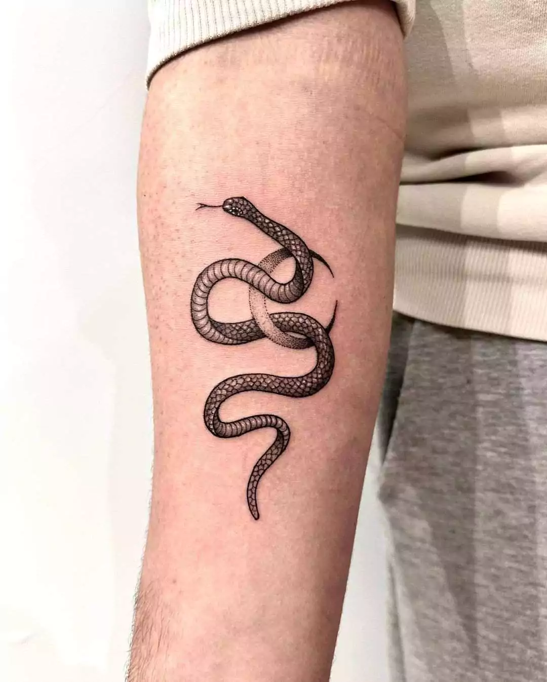 snake and moon arm tattoo