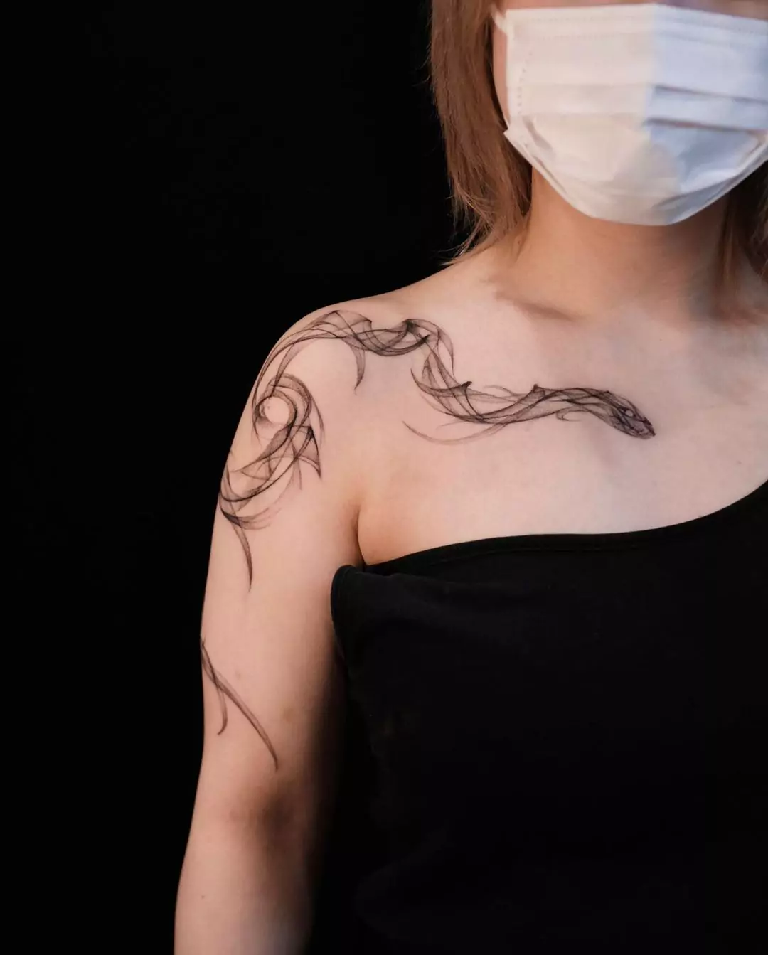 snake tattoo in smoke style