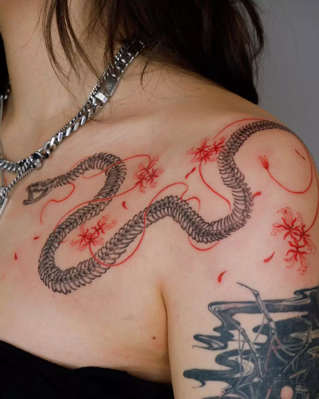 snake tattoo on the collarbone