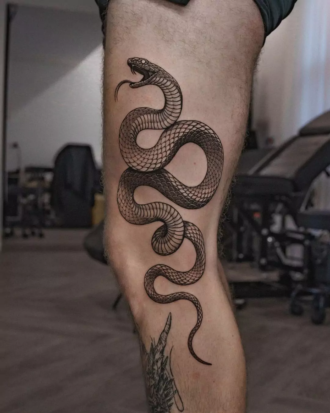 snake tattoo on the leg