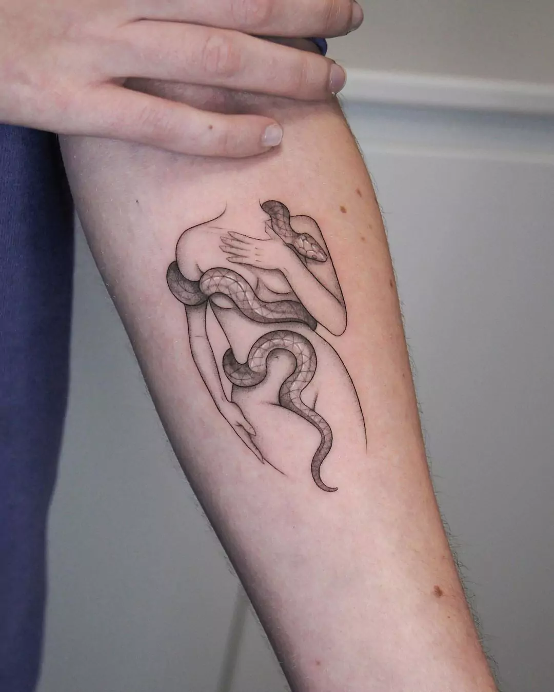 snake tattoo on the women