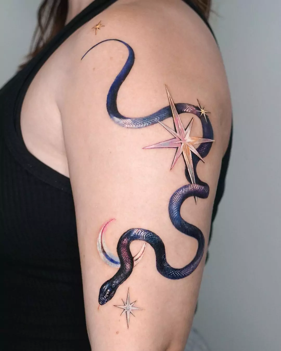 snake tattoo with moon and star