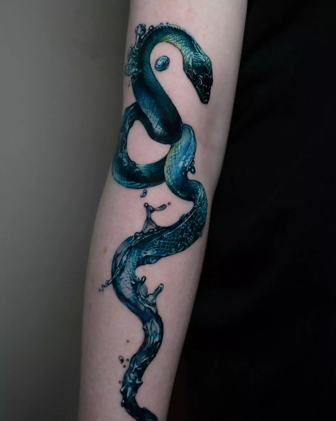 water effect snake hand tattoo