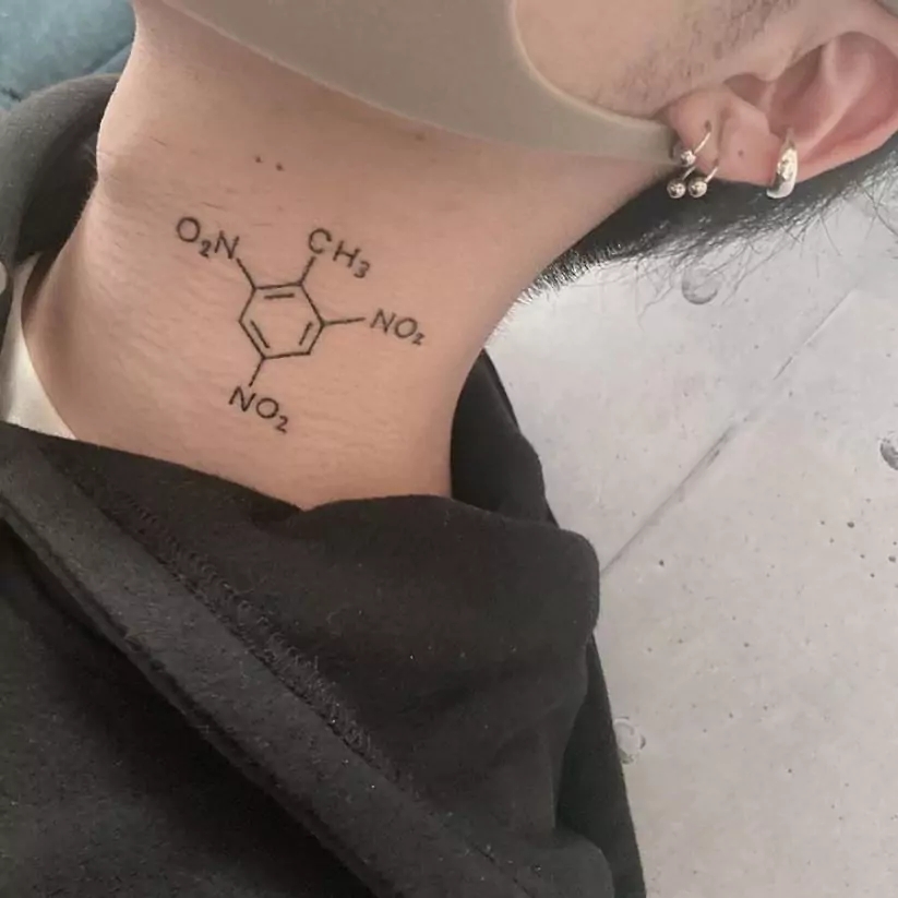 TNT neck tattoo