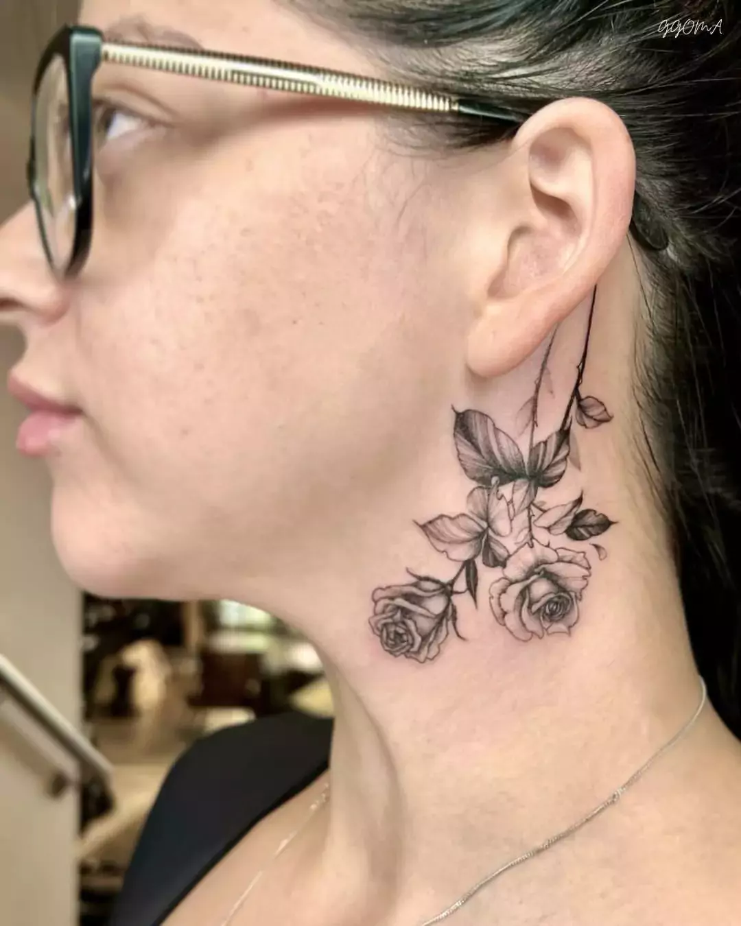 beautiful rose tattoo on the neck