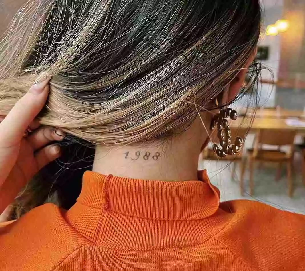 birth year tattoo on neck