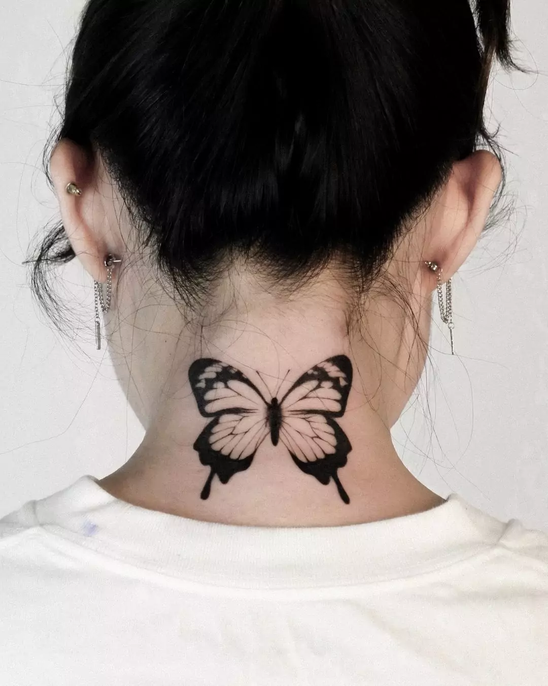 black butterfly nape tattoo