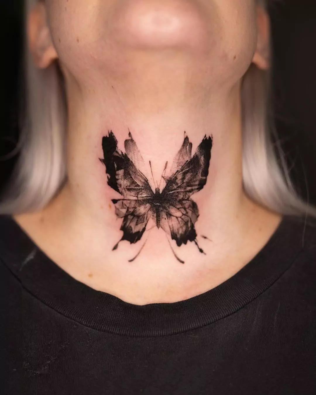 black butterfly neck tattoo