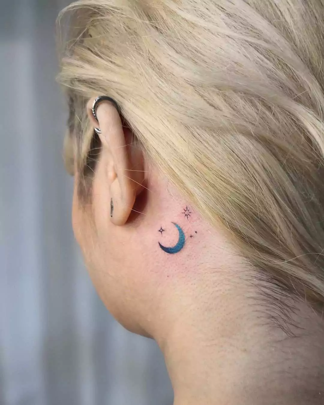 blue gradient moon tattoo on the neck