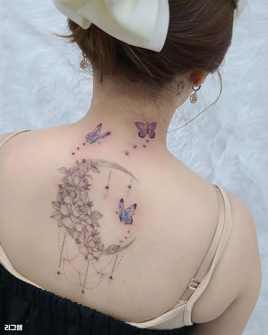 butterflies tattoo on the neck