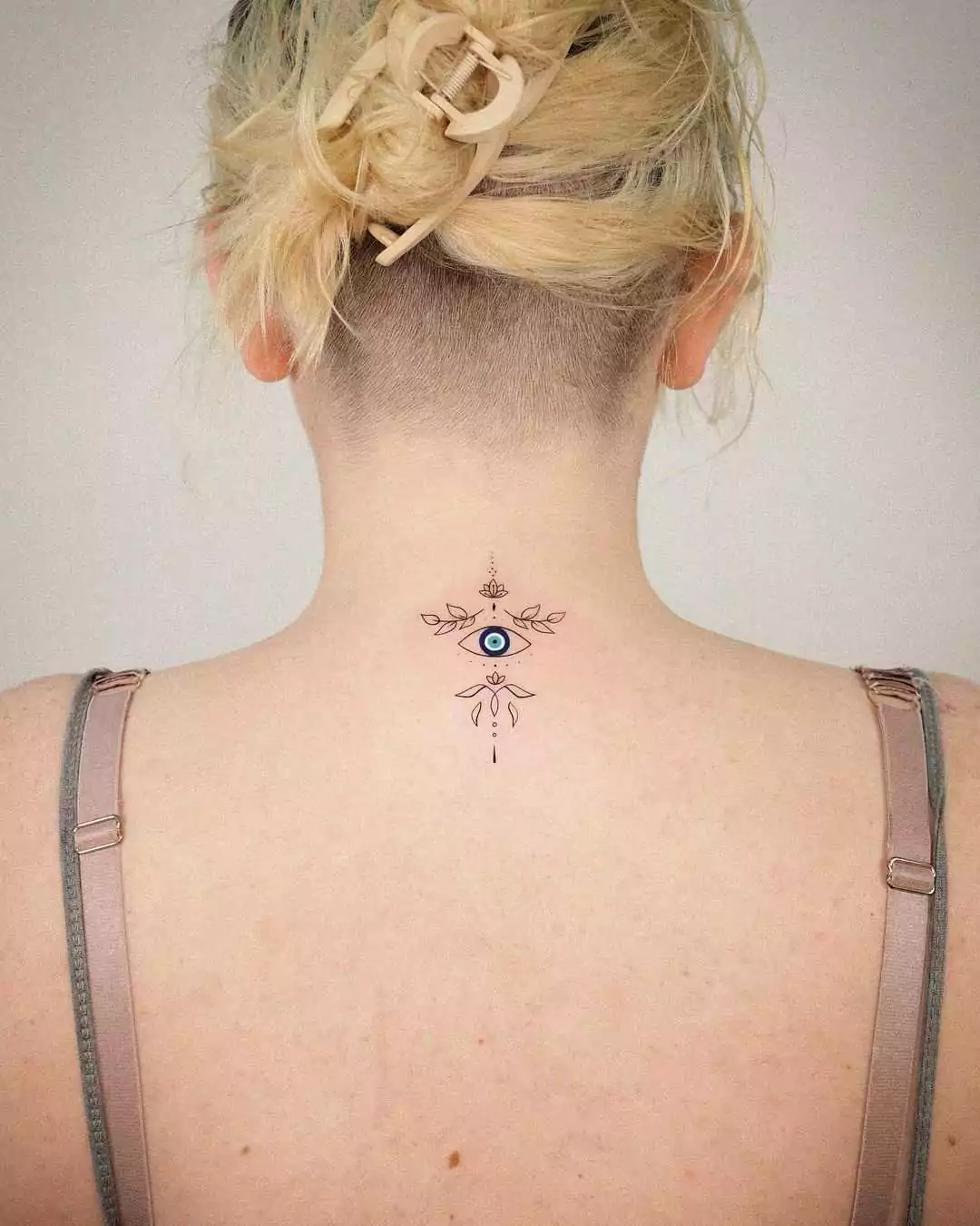 evil eye nape tattoo