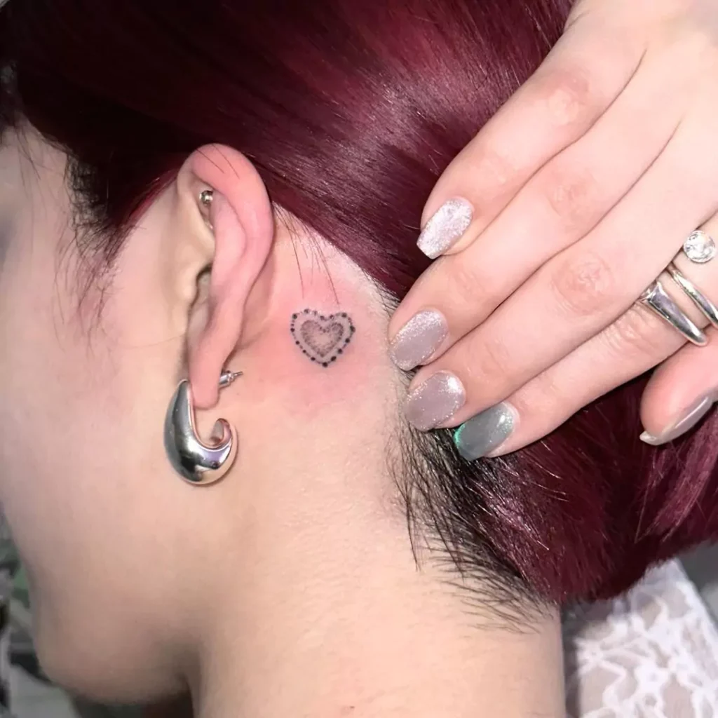 little heart tattoo on the neck