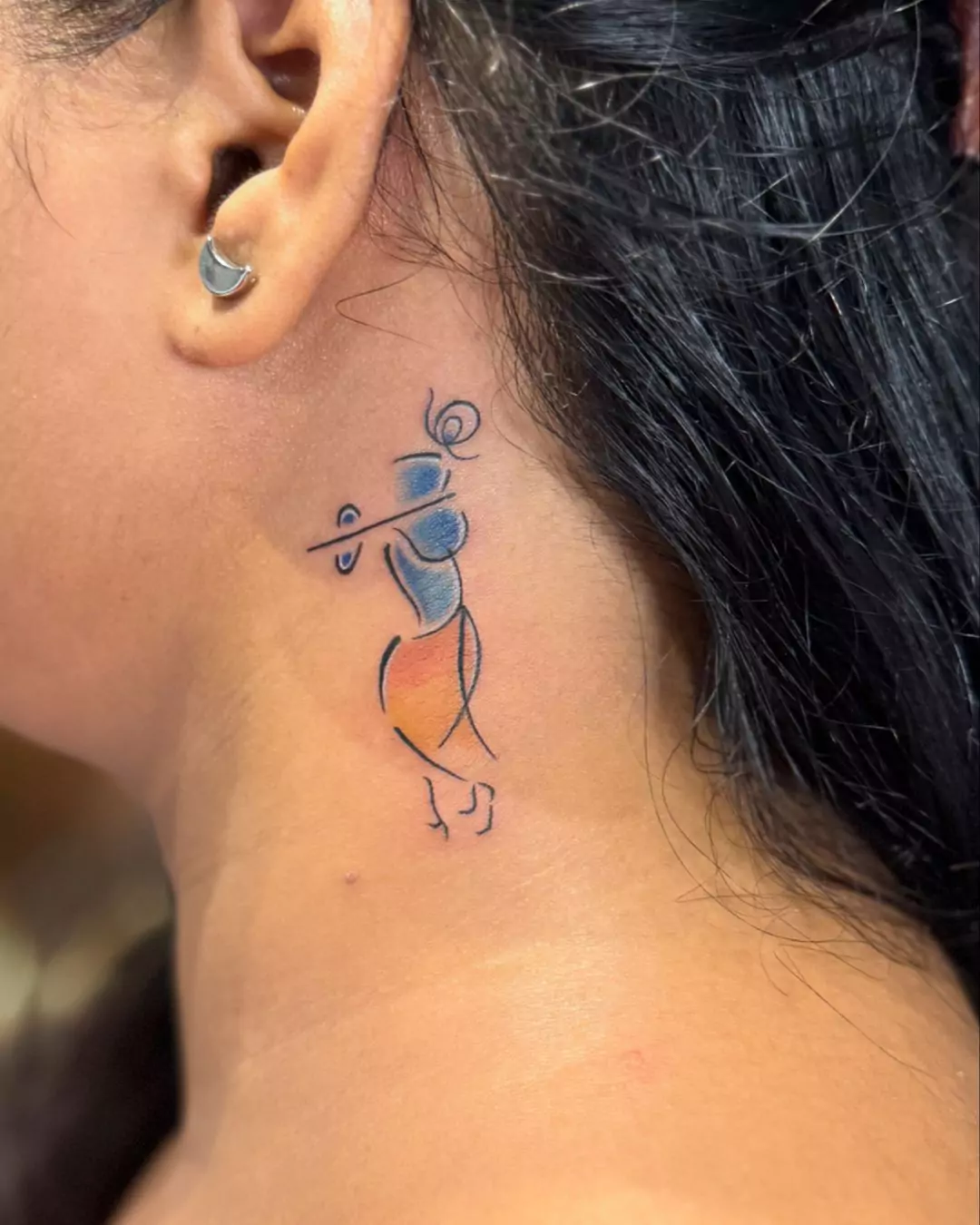 lord Krishna tattoo on the neck