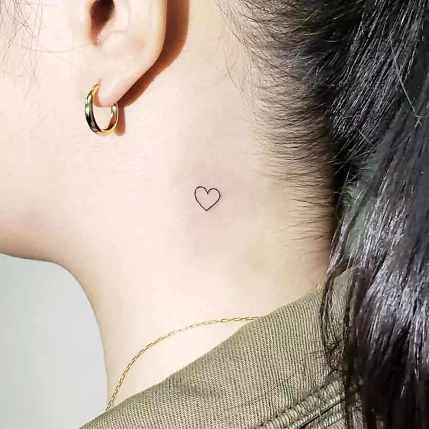 minimal heart tattoo on the neck