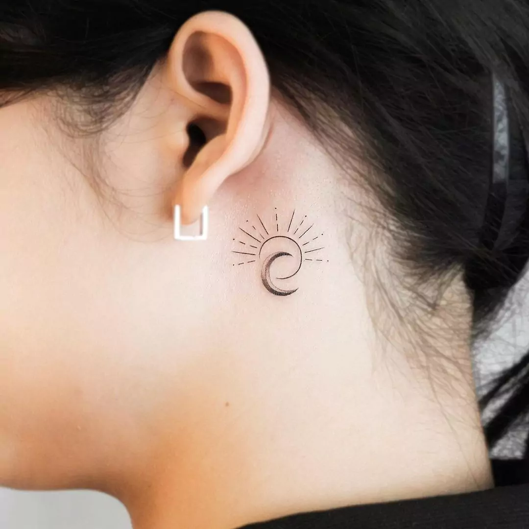 moon and sun tattoo on the neck