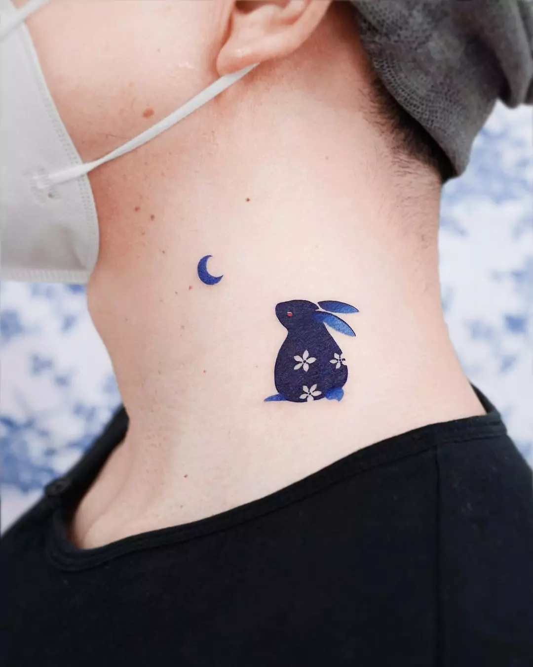 rabbit and moon tattoo on the neck