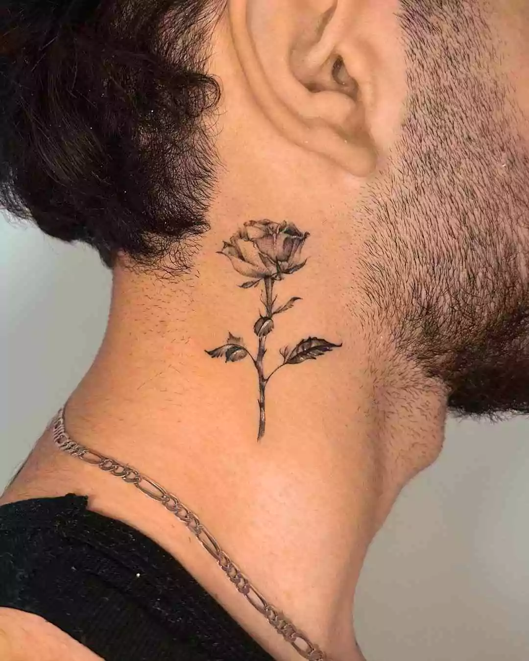 rose tattoo on the neck for men