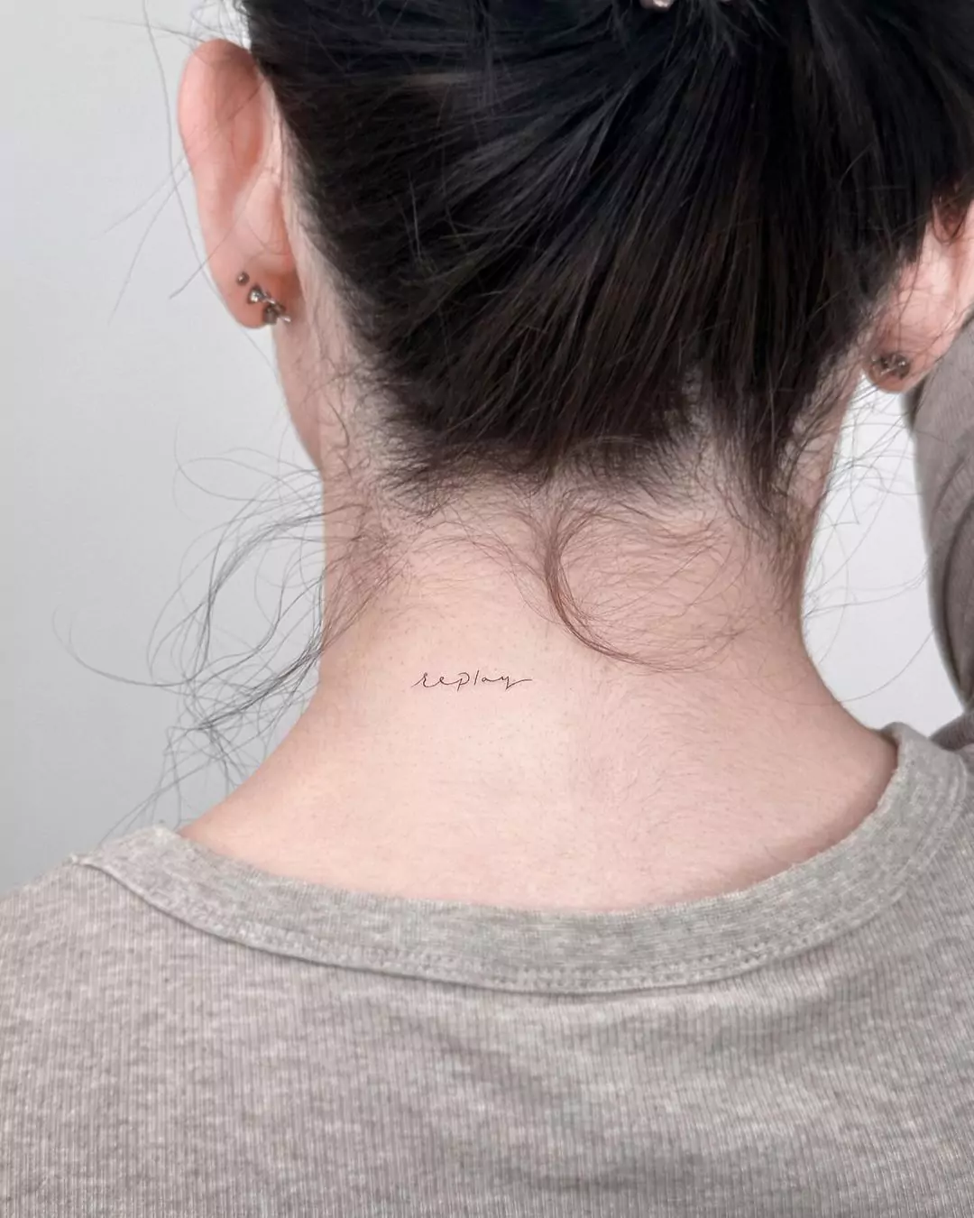 simple word tattoo on nape