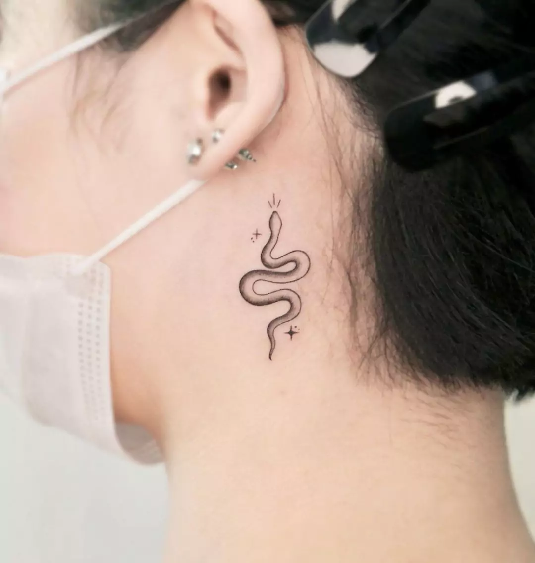 small snake tattoo on the neck