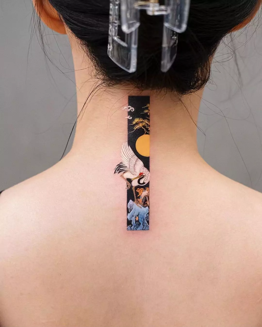 vertical frame tattoo on the nape