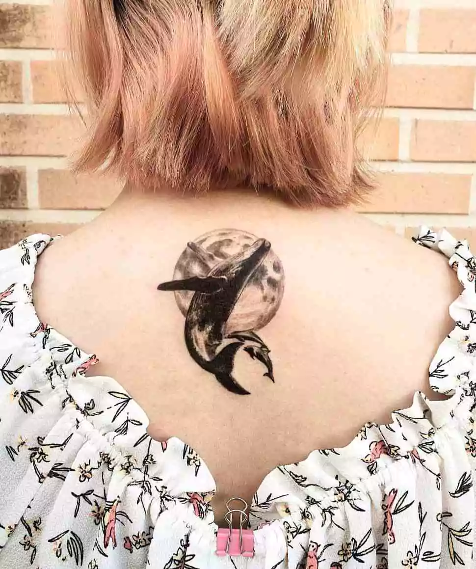 whale and moon neck tattoo