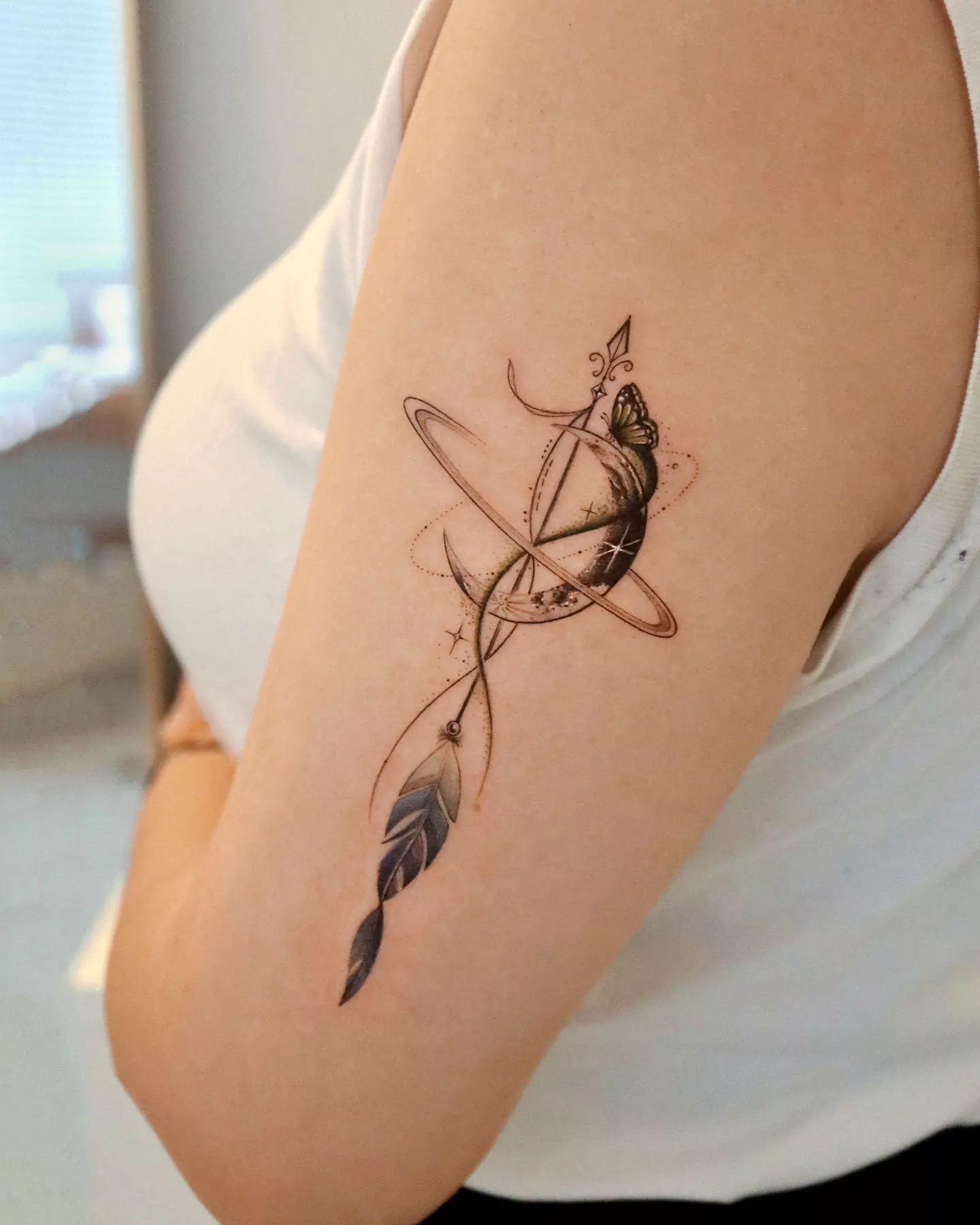 arrow and butterfly tattoo