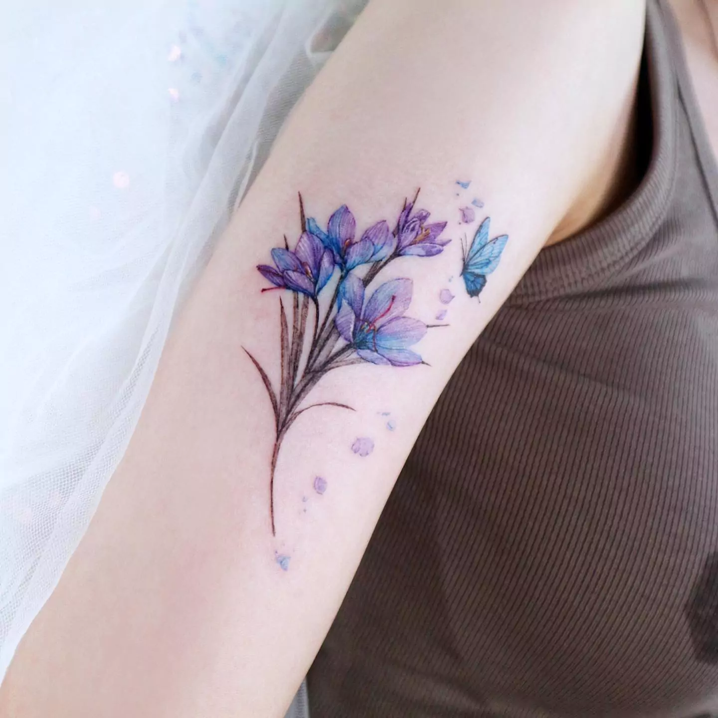 big flower and butterfly tattoo