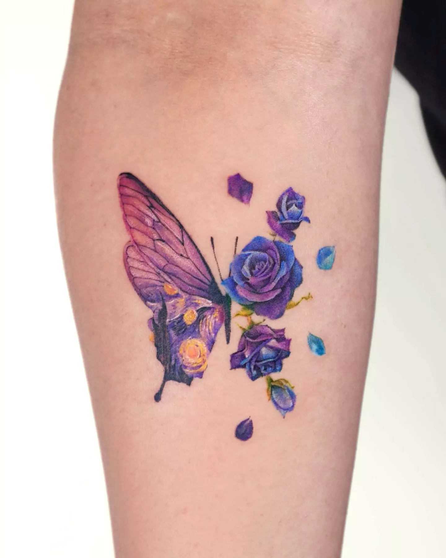 blue and purple butterfly and flower tattoo