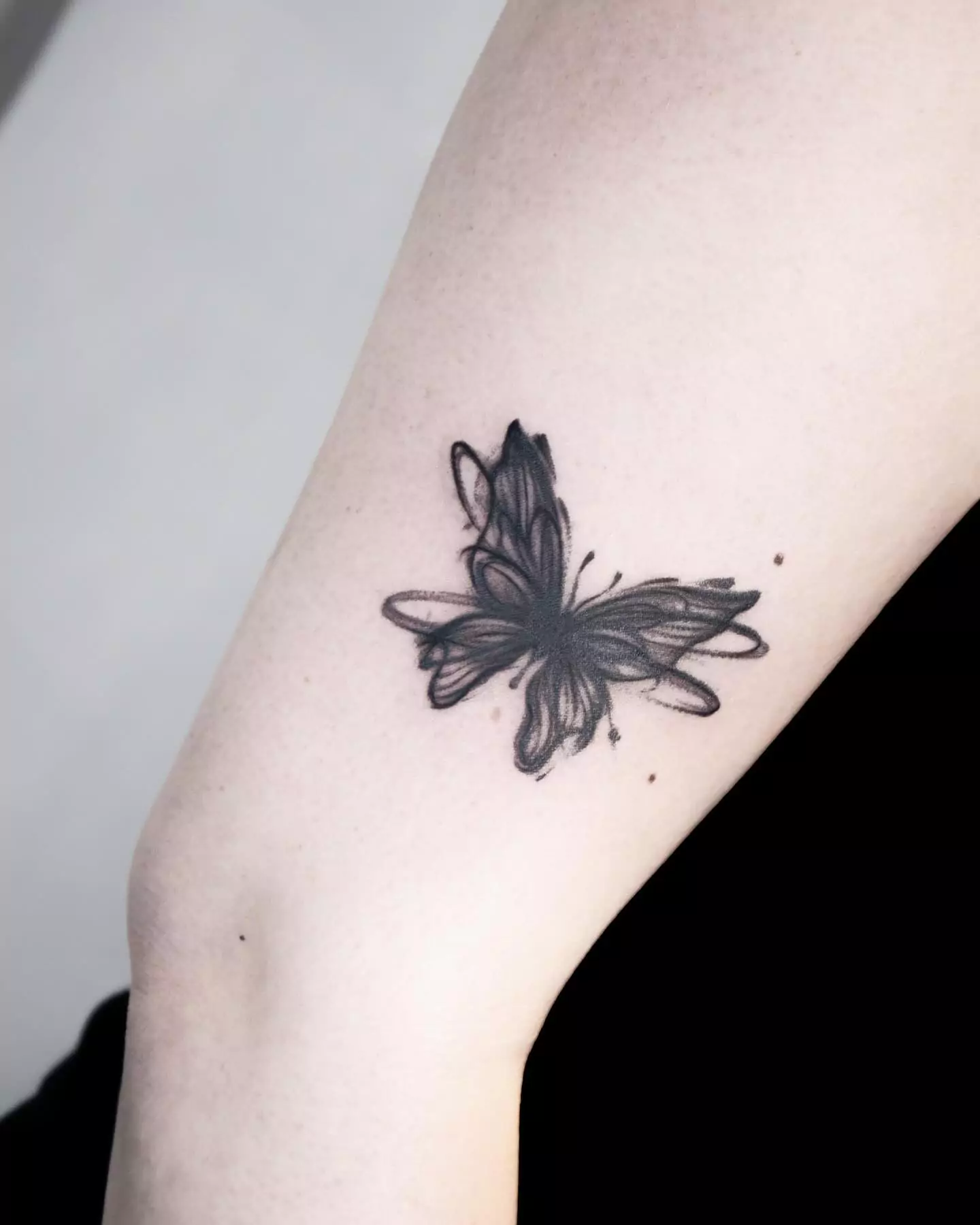 brush stroke butterfly tattoo