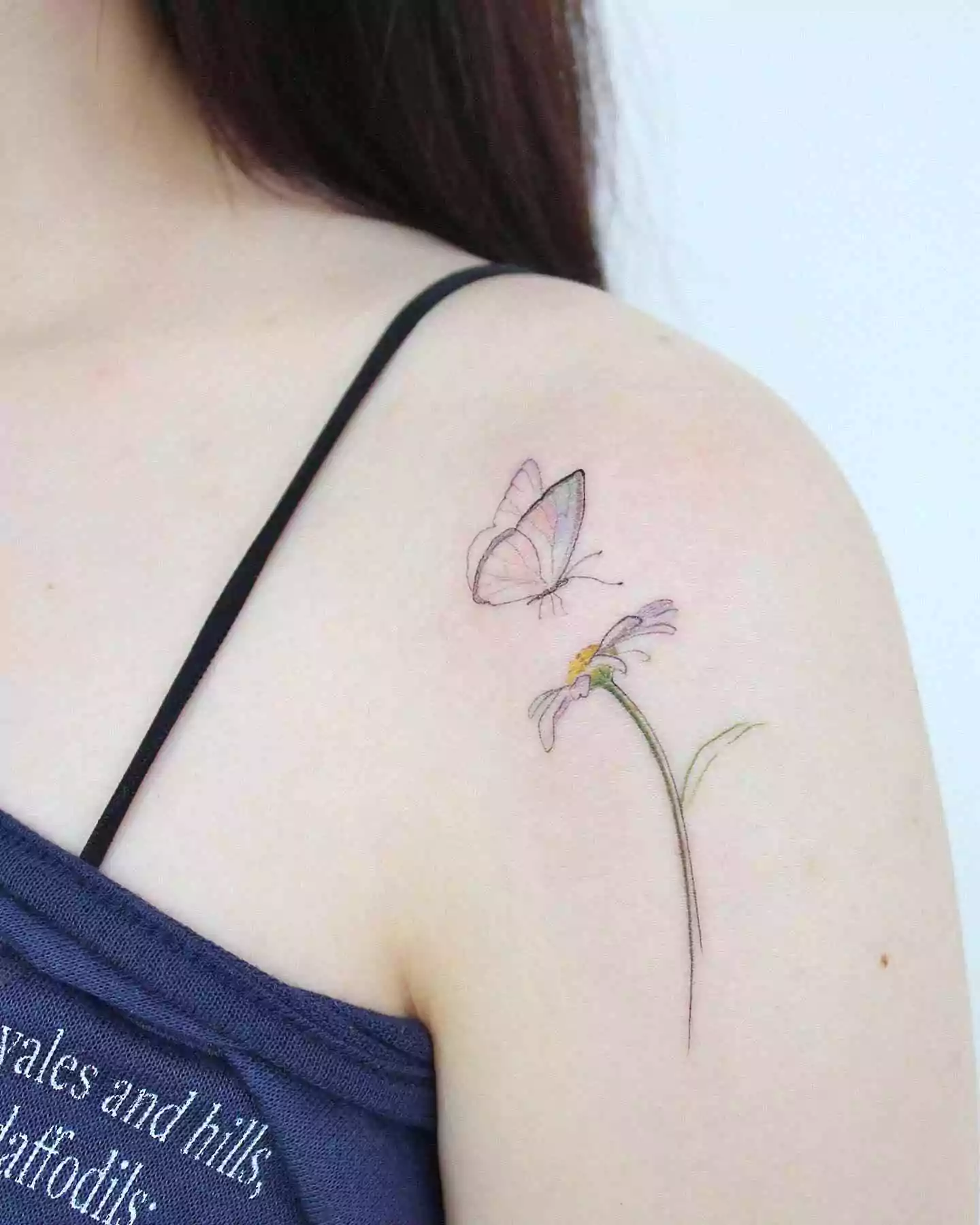 butterfly and flower hand tattoo