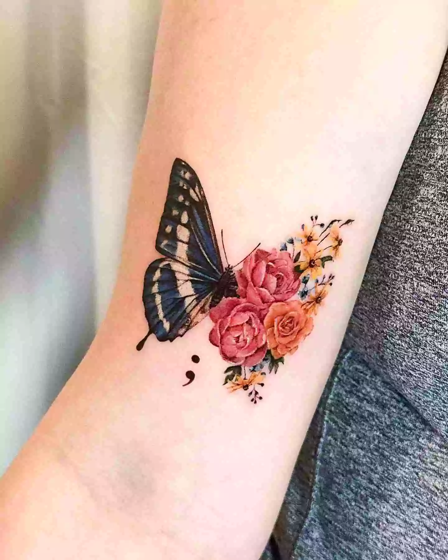 butterfly and flowers tattoo