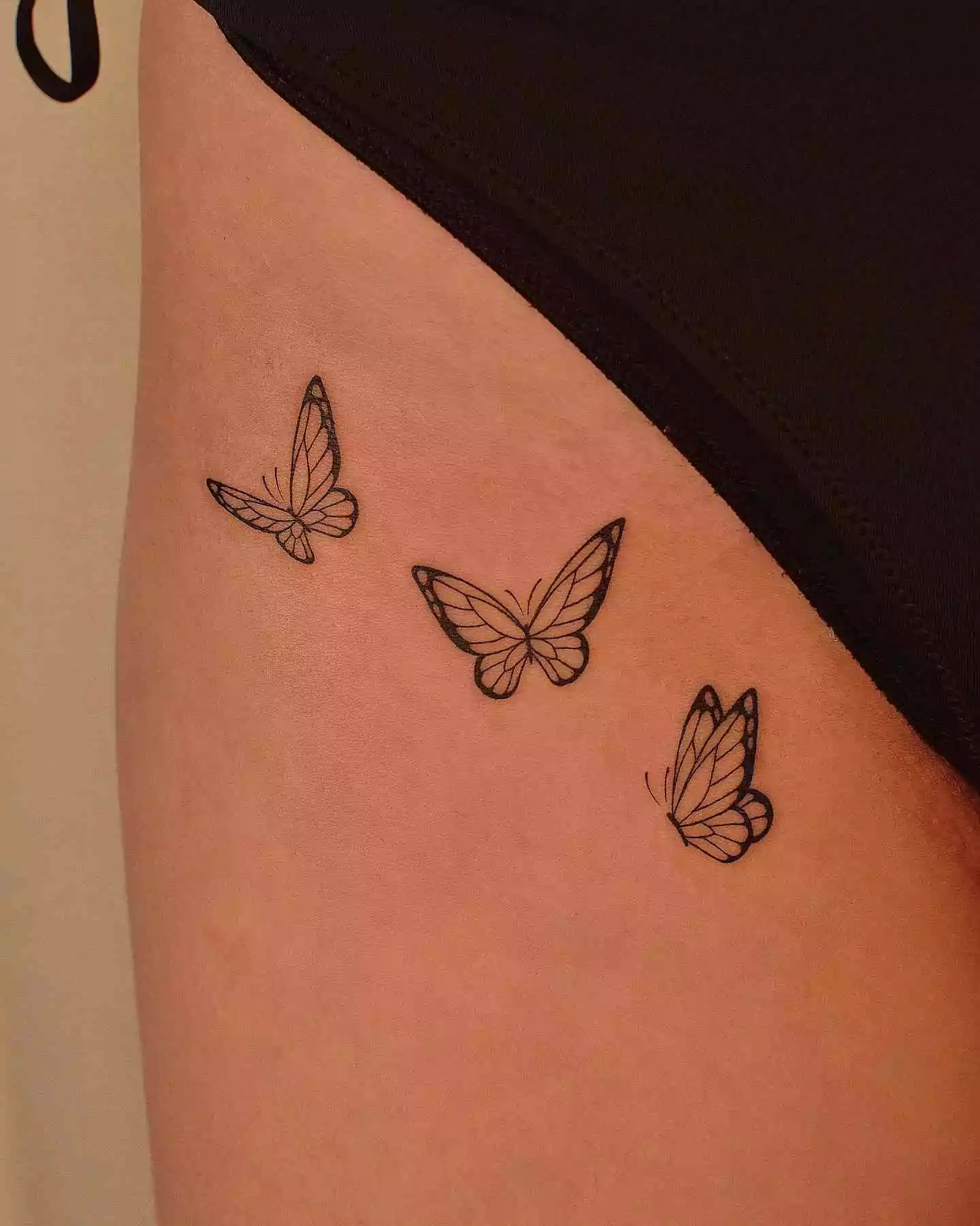 butterfly tattoo on thigh