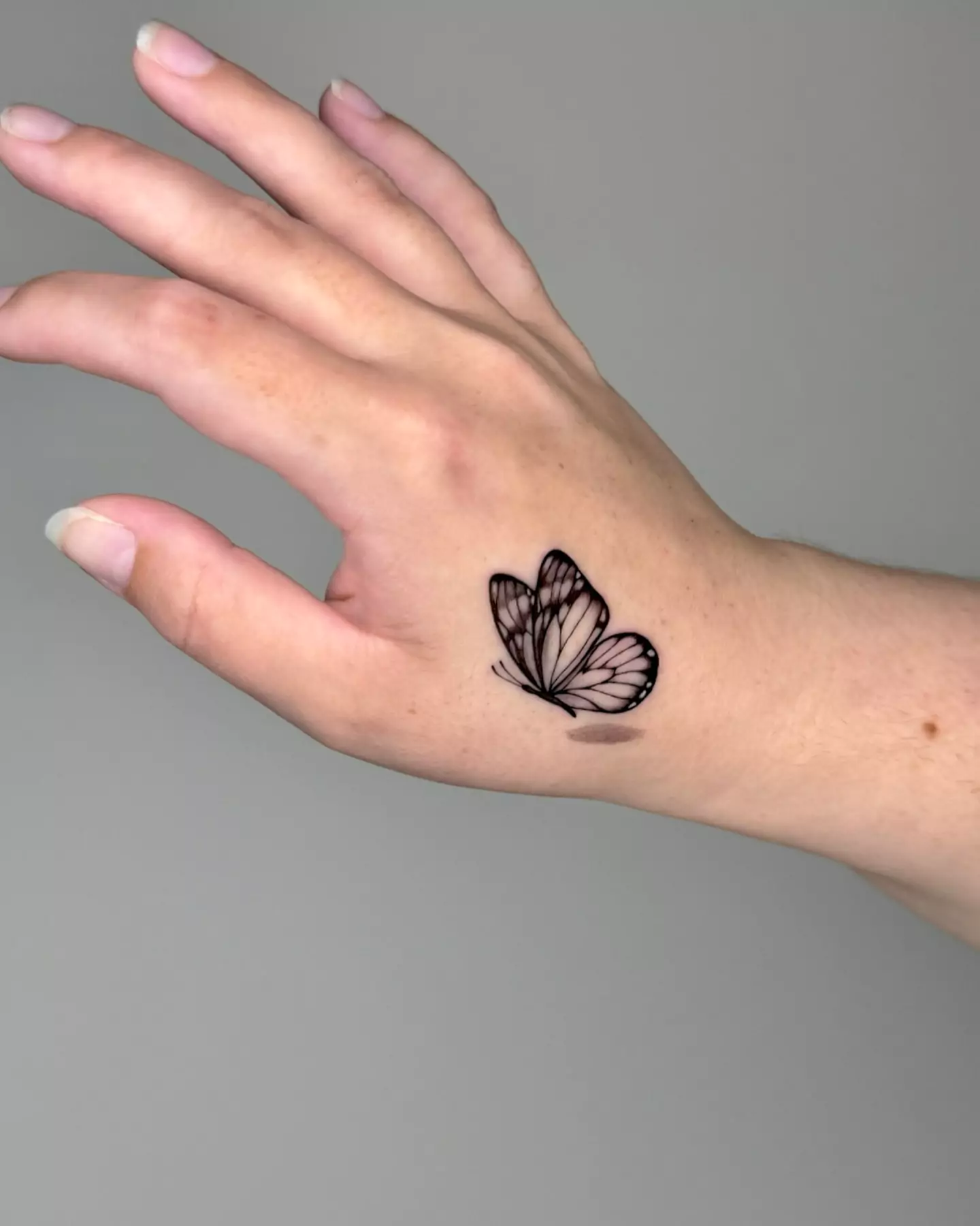 cute butterfly hand tattoo