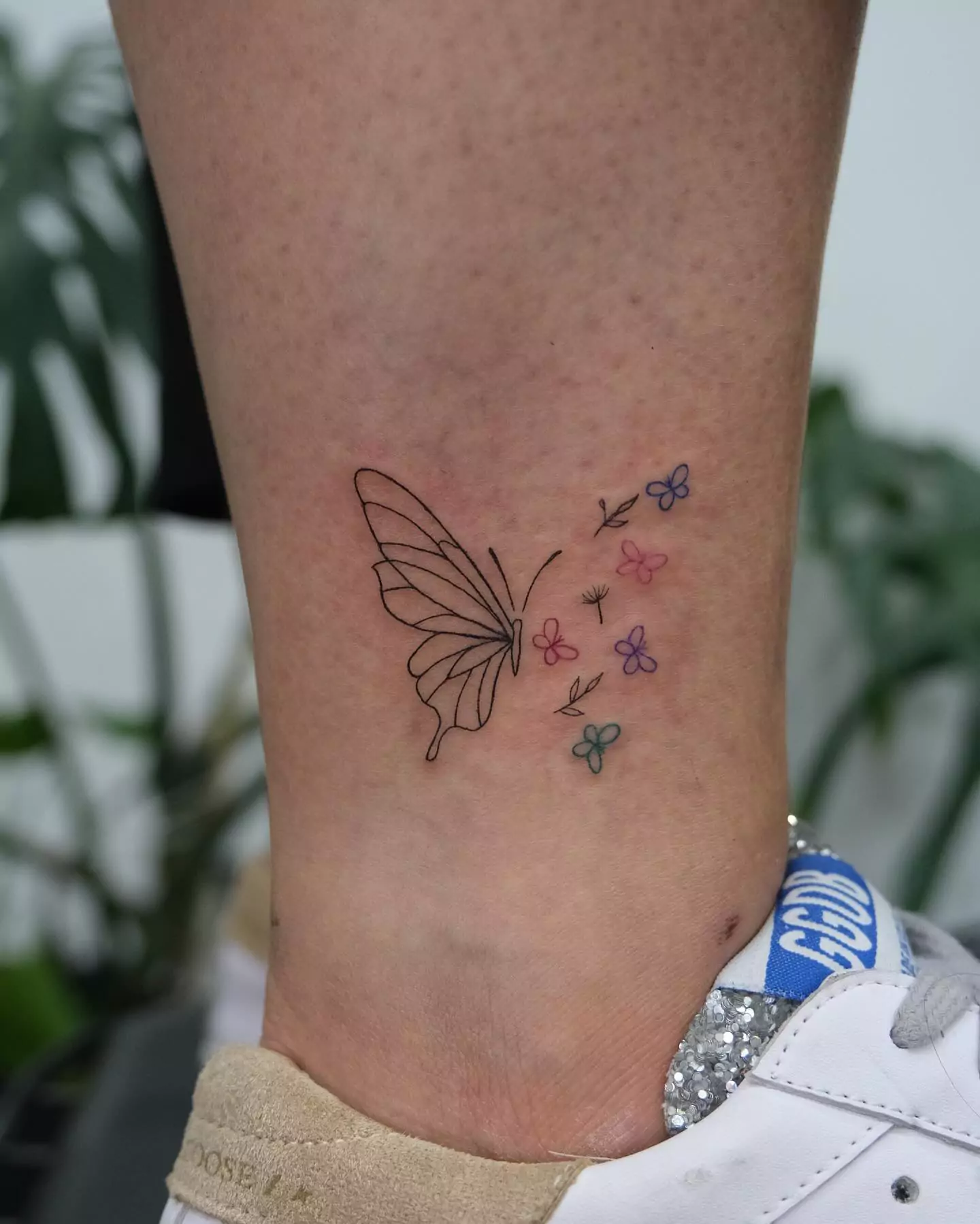 cute butterfly tattoo on the foot