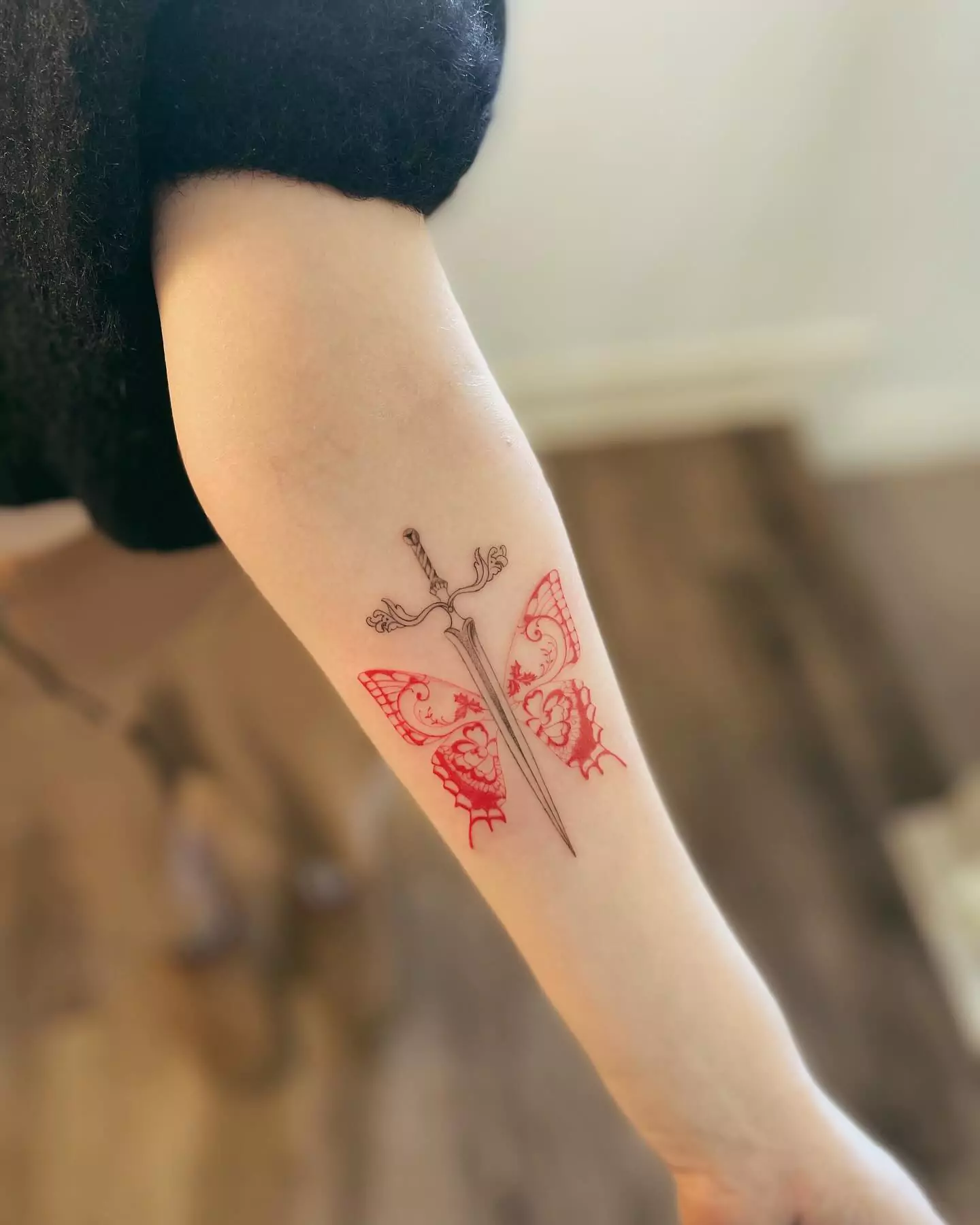 dagger and red butterfly tattoo