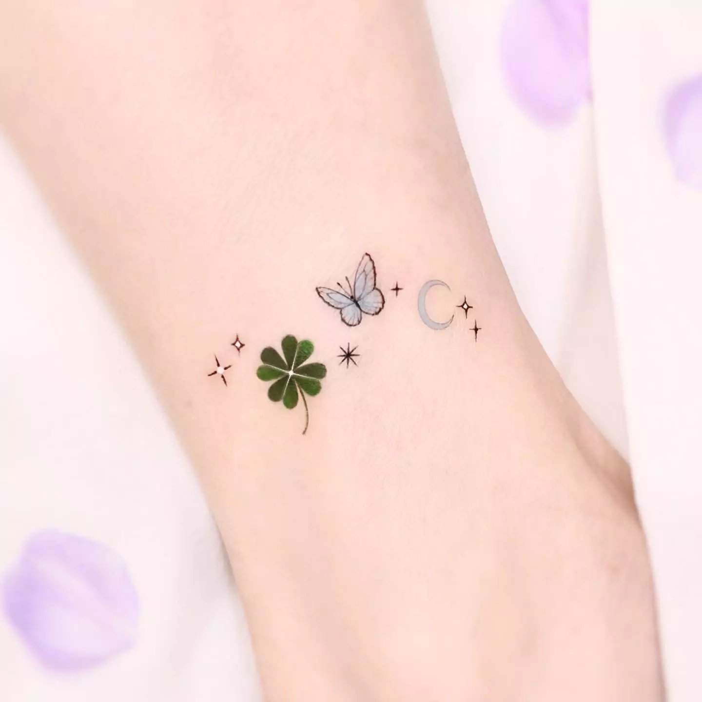 flower and butterfly tattoo on leg