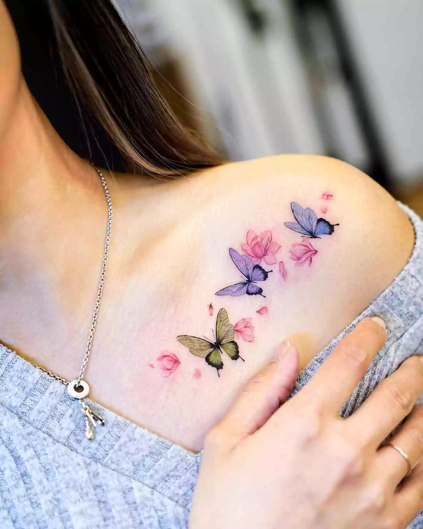 magnolia and butterfly tattoo