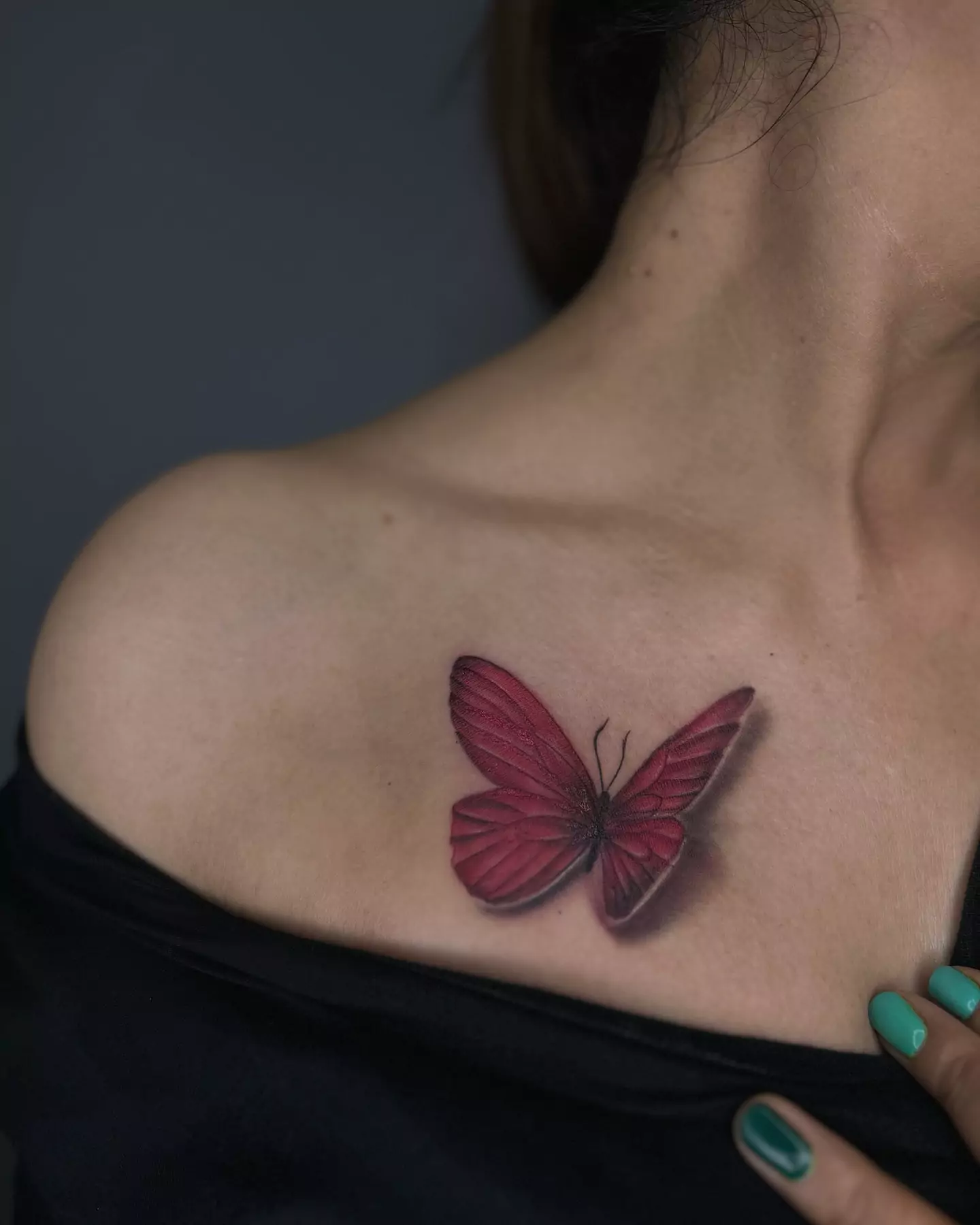 micro realism butterfly tattoo on collarbone