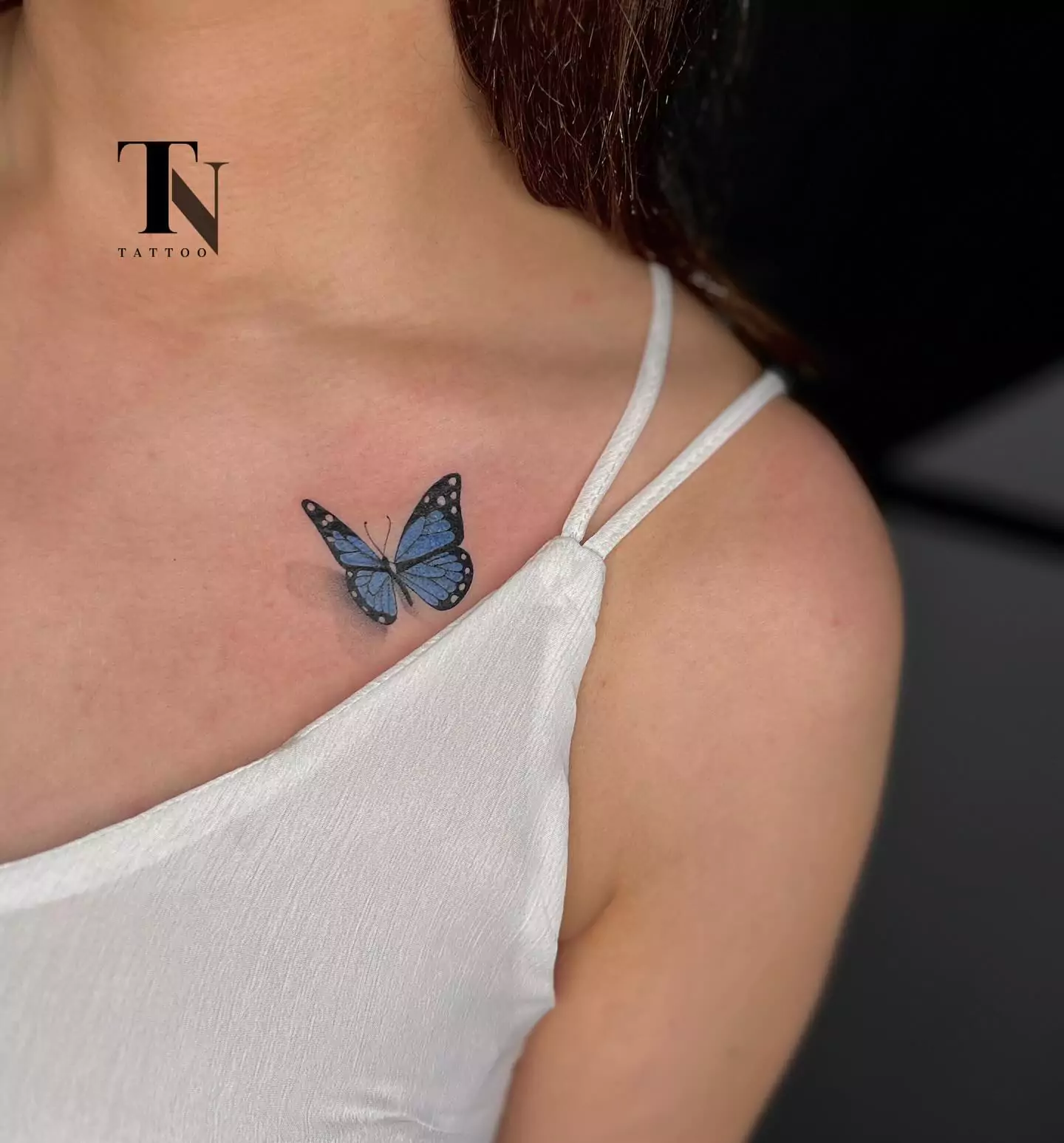 realistic butterfly collarbone tattoo