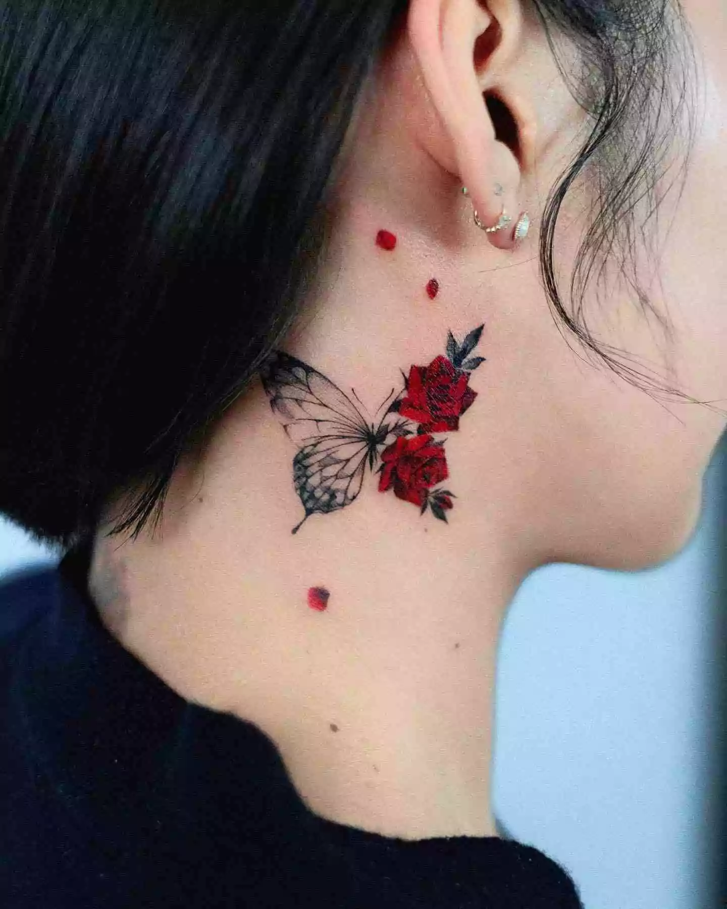 rose and butterfly ear tattoo