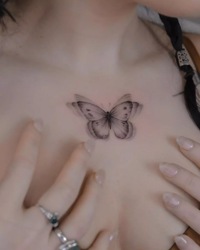 simple and cute butterfly tattoo on the chest