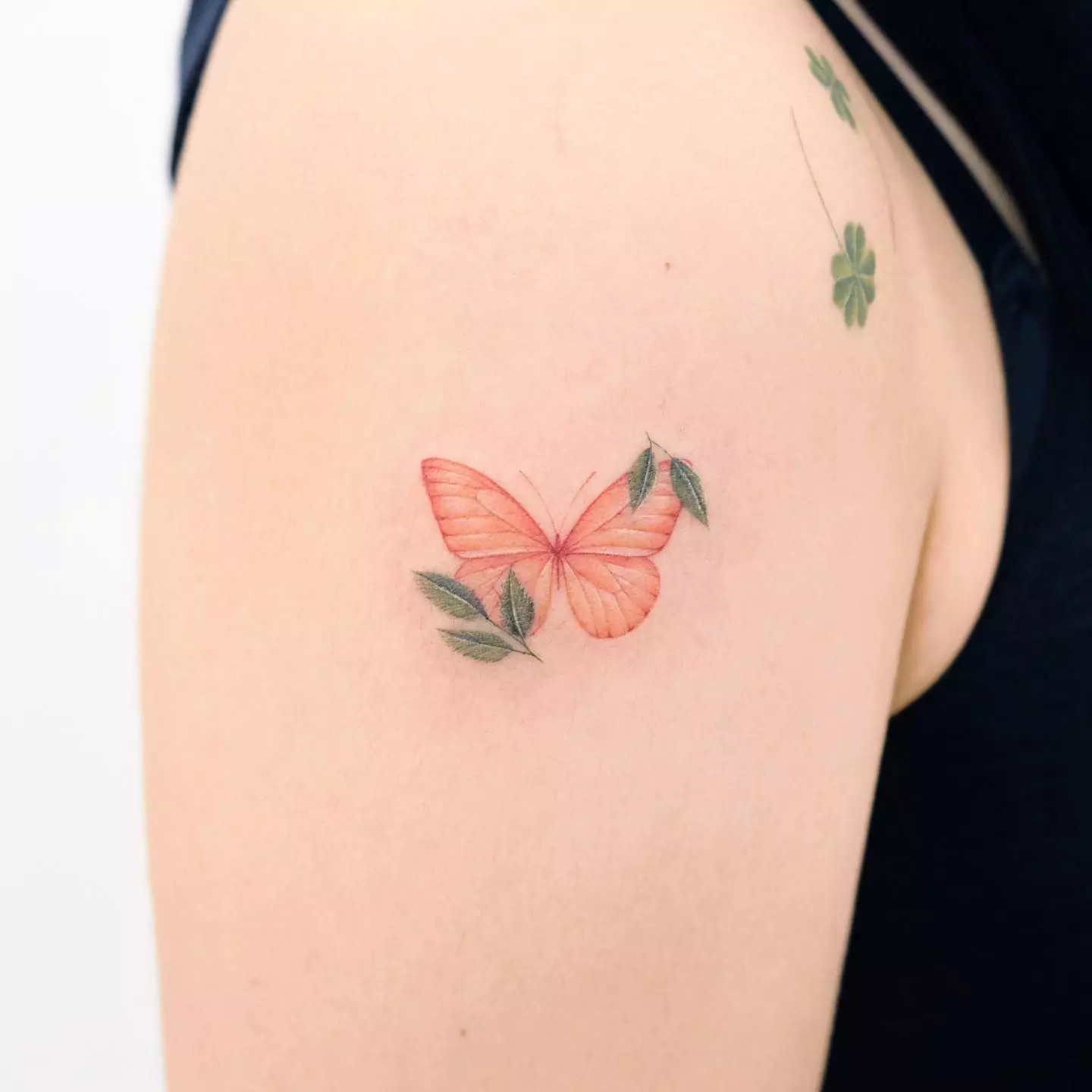 simple butterfly and leaves tattoo