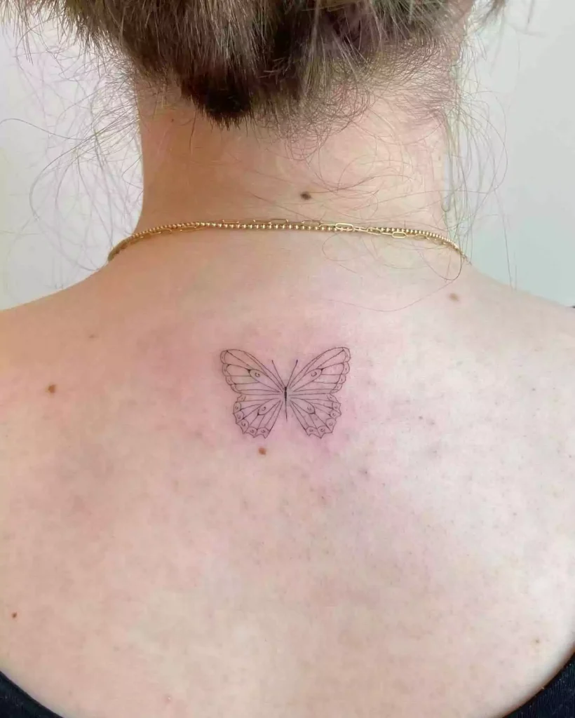 simple butterfly tattoo on the neck